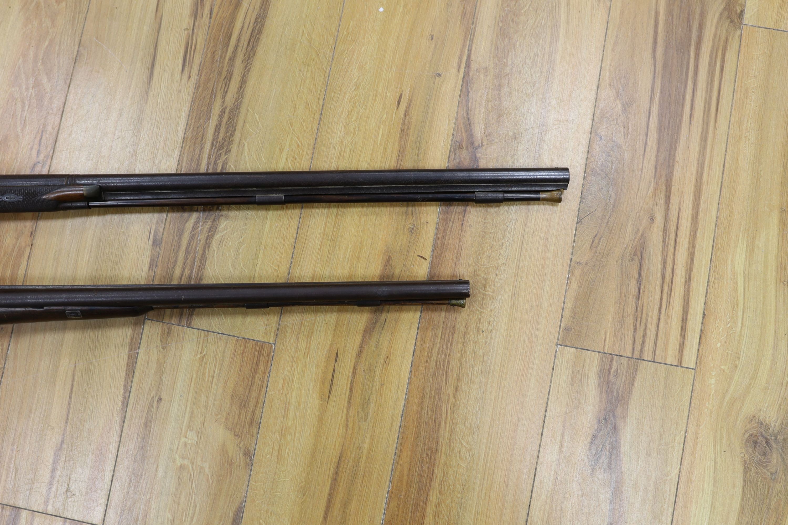 Two 19th century percussion muskets, 103cm. max., one double-barrelled